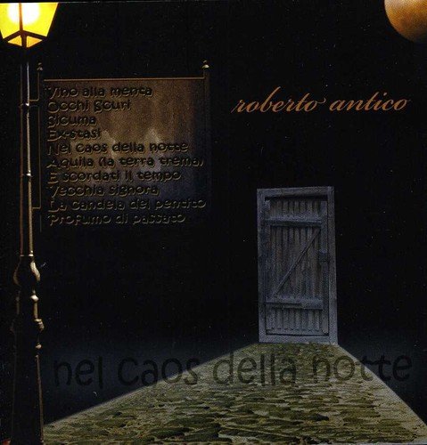 CD cover: dark street scene with a doorway and lamppost.