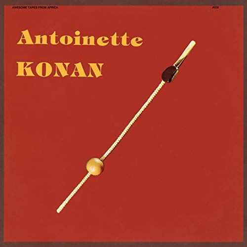 Red album cover with yellow text and a wooden percussion instrument.