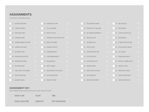 Book page listing 52 photography assignments in columns with a key below.