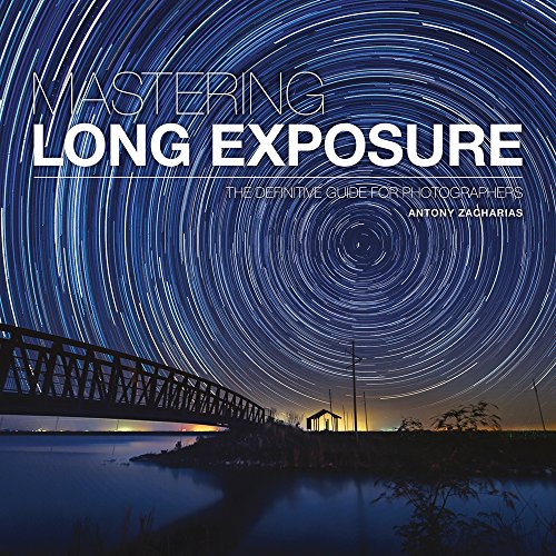 Book cover with swirling star trails over a bridge and water.