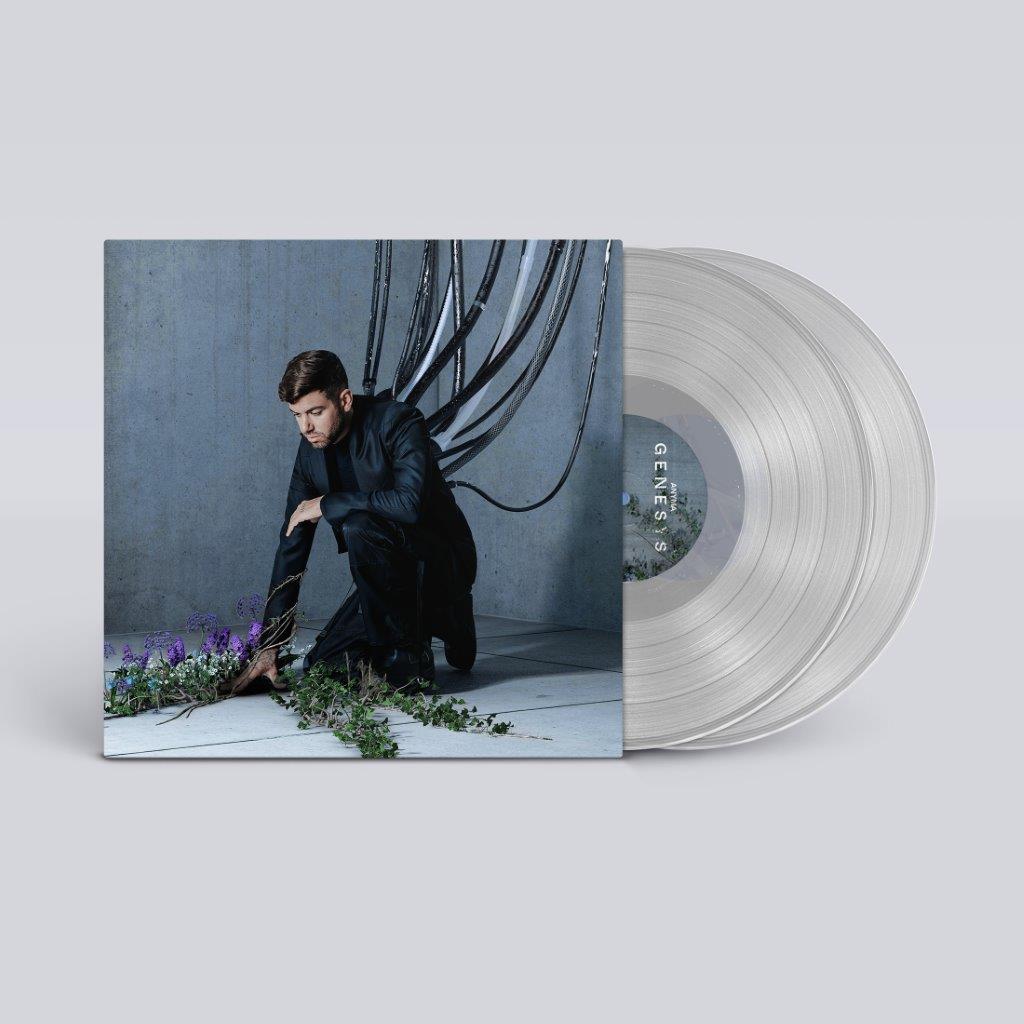 "Clear vinyl record with album cover featuring a man surrounded by vines and flowers."