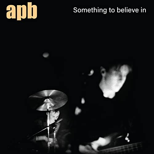 Black and white album cover featuring a drummer and guitar player.