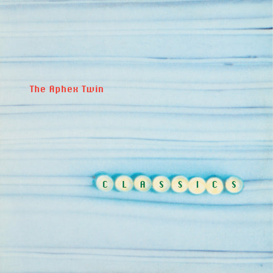 Aphex Twin “Classics” CD cover with light blue striped background and lettered tiles.
