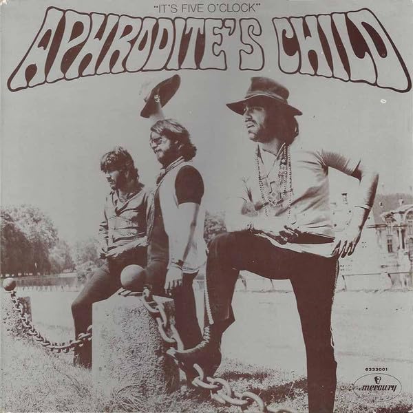 Sepia-toned album cover featuring the band Aphrodite's Child posing outdoors near a chain fence.