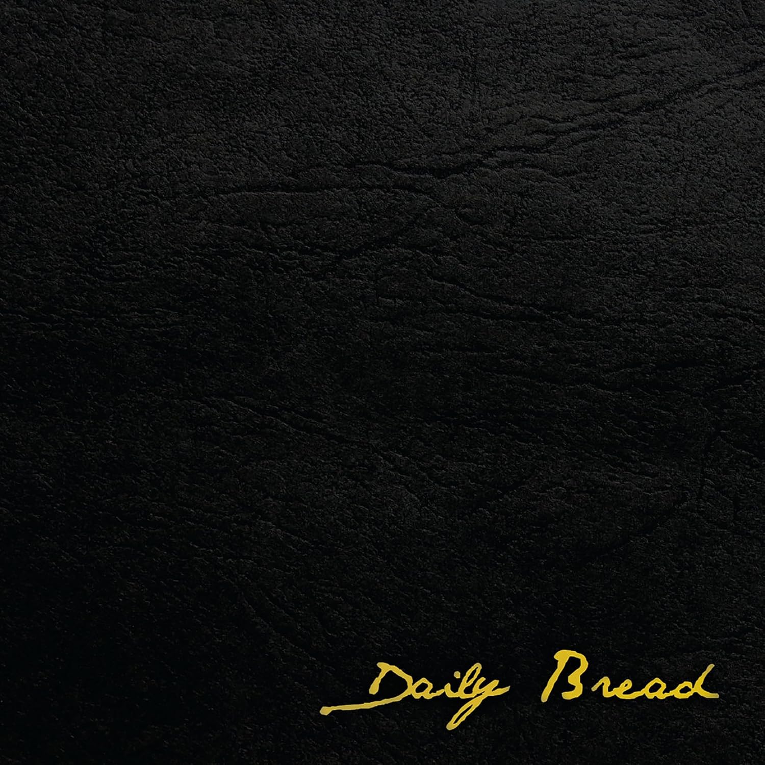 Black textured background with gold script reading "Daily Bread".