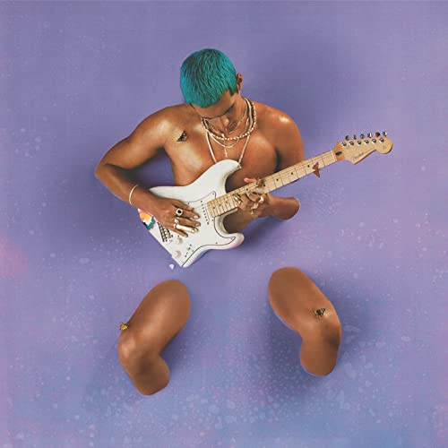 Man with teal hair playing white electric guitar, dismembered limbs.