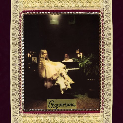 Vinyl album cover featuring a woman with long hair at a piano.