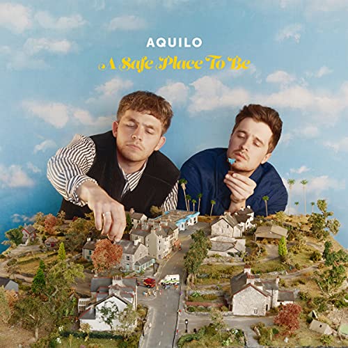 CD cover for Aquilo’s “A Safe Place To Be” featuring two men and a miniature town.