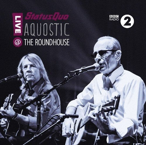Black and white image of two men singing and playing acoustic guitars on a DVD cover.