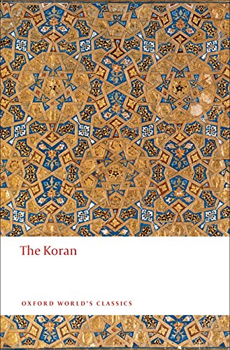 Book cover: “The Koran” with ornate gold and blue Islamic geometric patterns.