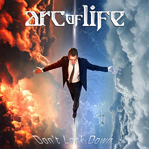 CD cover: man in suit balancing between fire and sky.