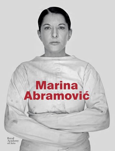 Black and white portrait of Marina Abramović in a straitjacket.