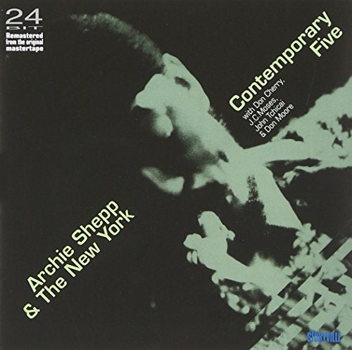 Album cover with a black background and green-toned man's profile image.