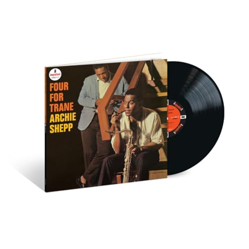 Archie Shepp’s “Four For Trane” vinyl record with album cover featuring two men.