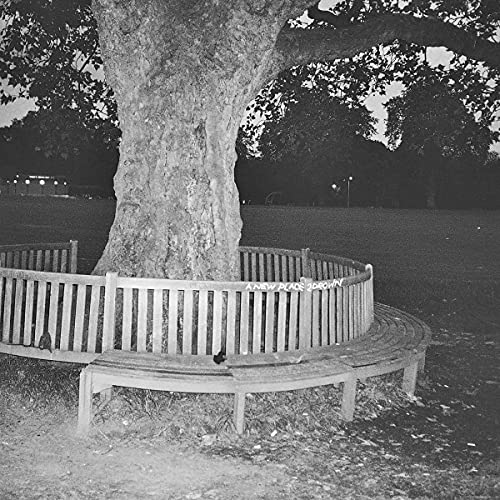 Black and white album cover featuring a tree and park bench.
