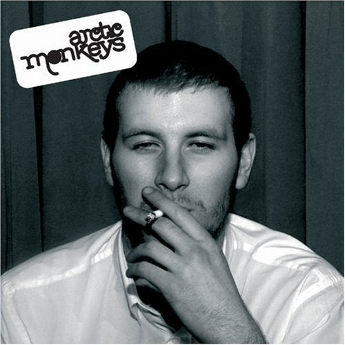 Black and white vinyl album cover featuring a man smoking a cigarette.