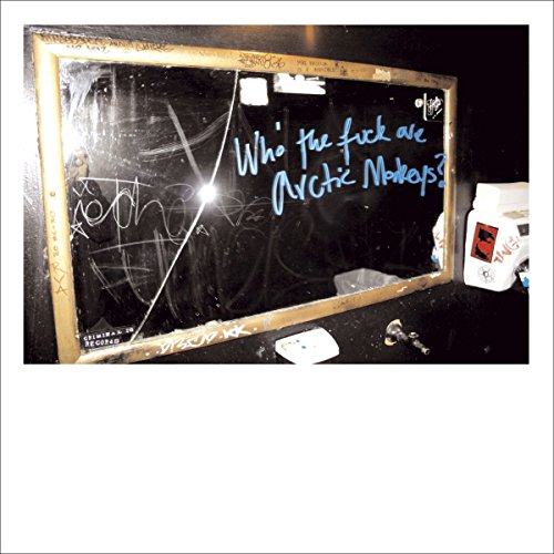 Polaroid-style photo of a chalkboard with handwritten text: "Who the fuck are Arctic Monkeys?".