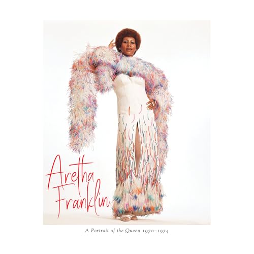 Aretha Franklin in a white dress and colorful feather boa, album cover.