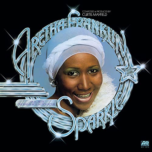 Aretha Franklin’s “Sparkle” vinyl album cover with her portrait in a circle.