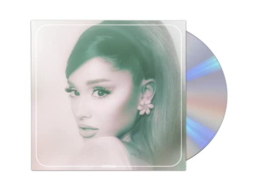 Woman's face on album cover with green tint and flower earring beside a CD.