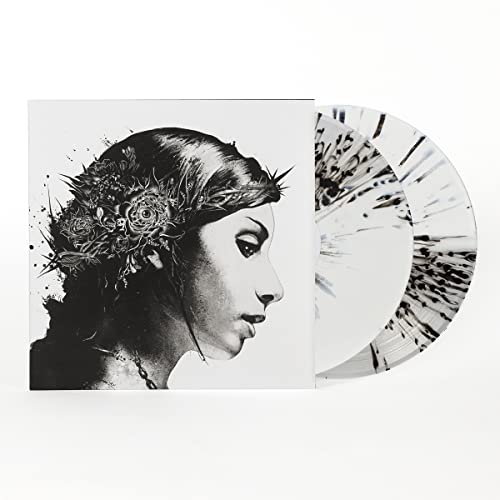 Vinyl record with black and white floral portrait album cover.