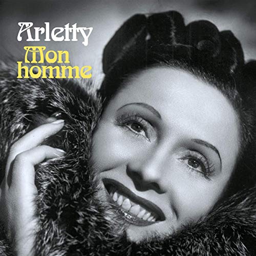 Black and white album cover featuring a smiling woman in a fur coat.