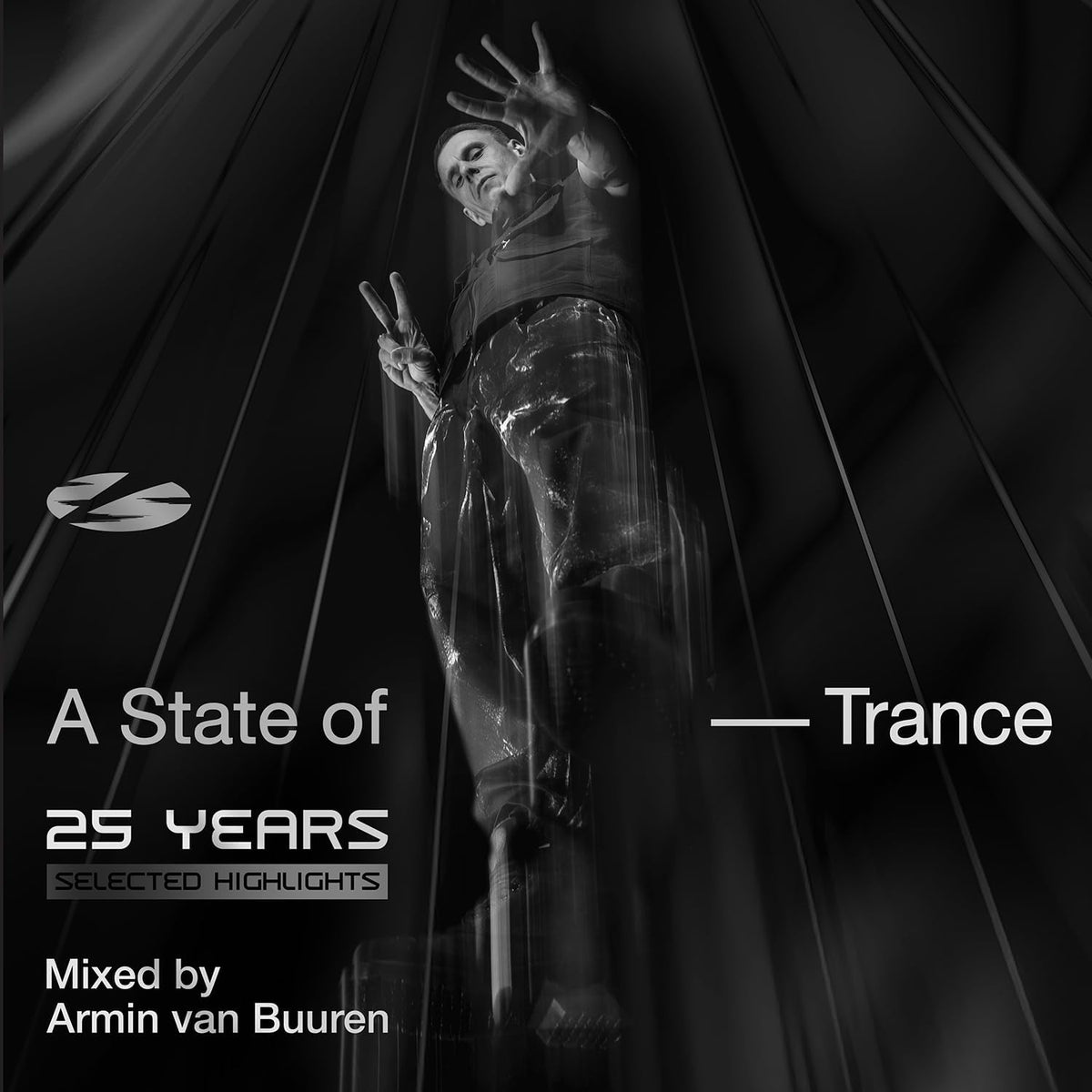 Armin van Buuren performing with light beams and album artwork text.