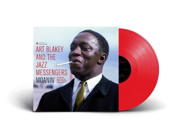 Art Blakey album cover “Moanin’” with a red vinyl record beside it.