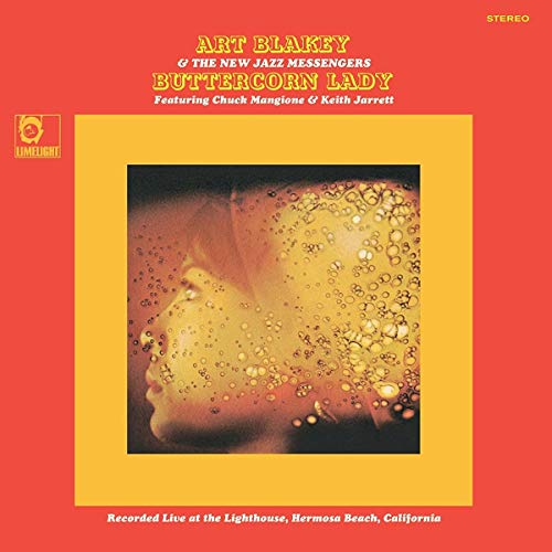 Red album cover with yellow text and a central abstract image.