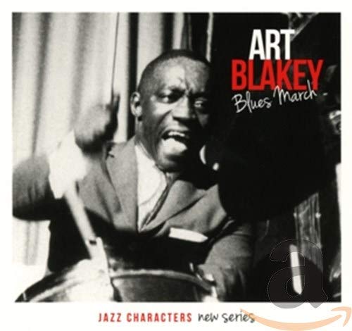 Black and white portrait of jazz drummer Art Blakey playing drums.