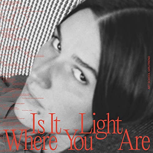 Black and white portrait with red text: “Is It Light Where You Are.”