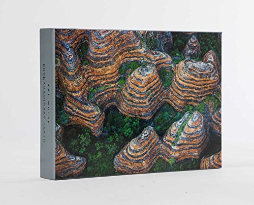 Book cover featuring layered, colorful rock formations and green vegetation.