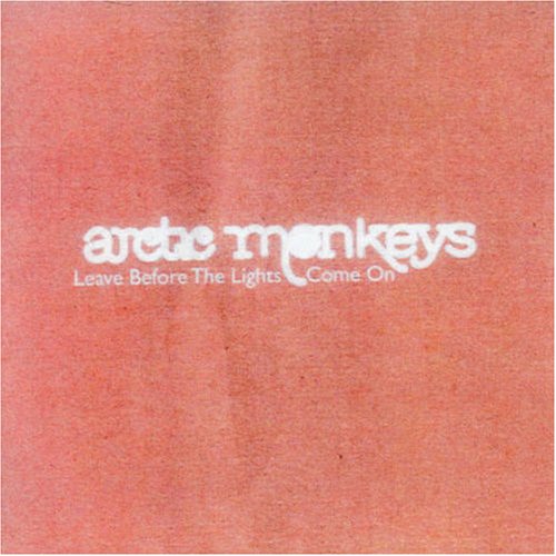Arctic Monkeys Leave Before The Lights Come On text in white on salmon background.