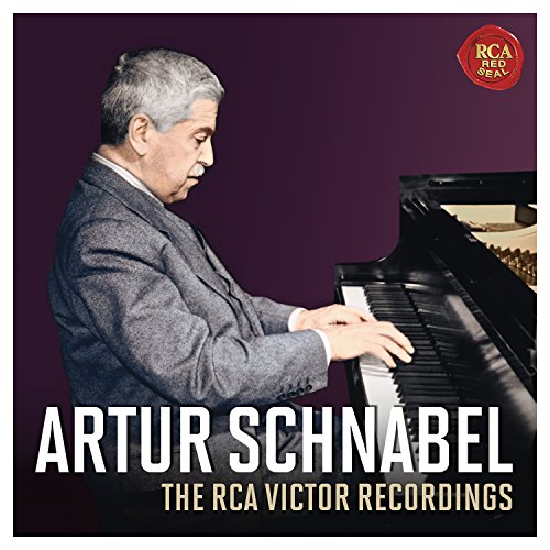 Black and white portrait of pianist Artur Schnabel at a piano.