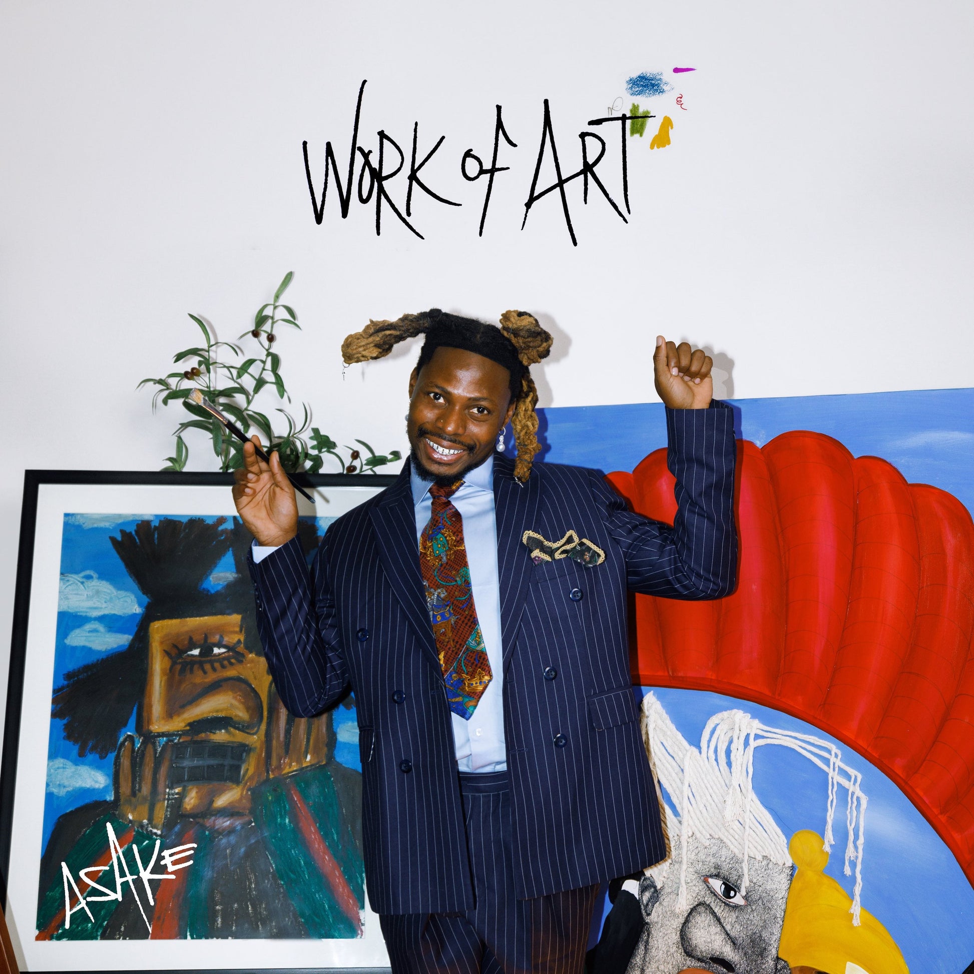 Asake album cover featuring artist in suit with painted artwork.