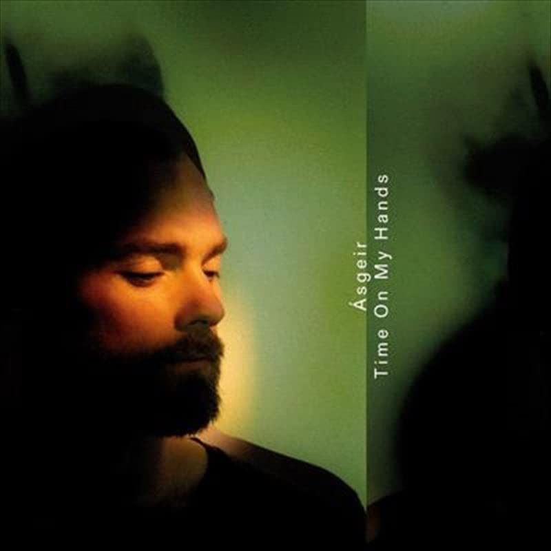 Asgeir album cover: portrait of a man with green and black tones.