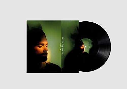 Asgeir album cover and black vinyl record against a white background.