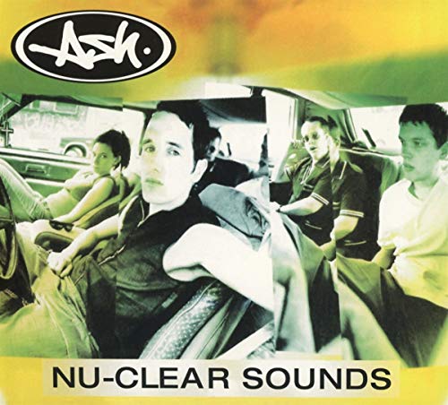 "Album cover with band members in a car, yellow and green tint."