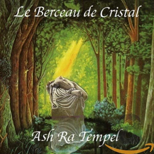 CD cover: statue in a forest with light streaming down.