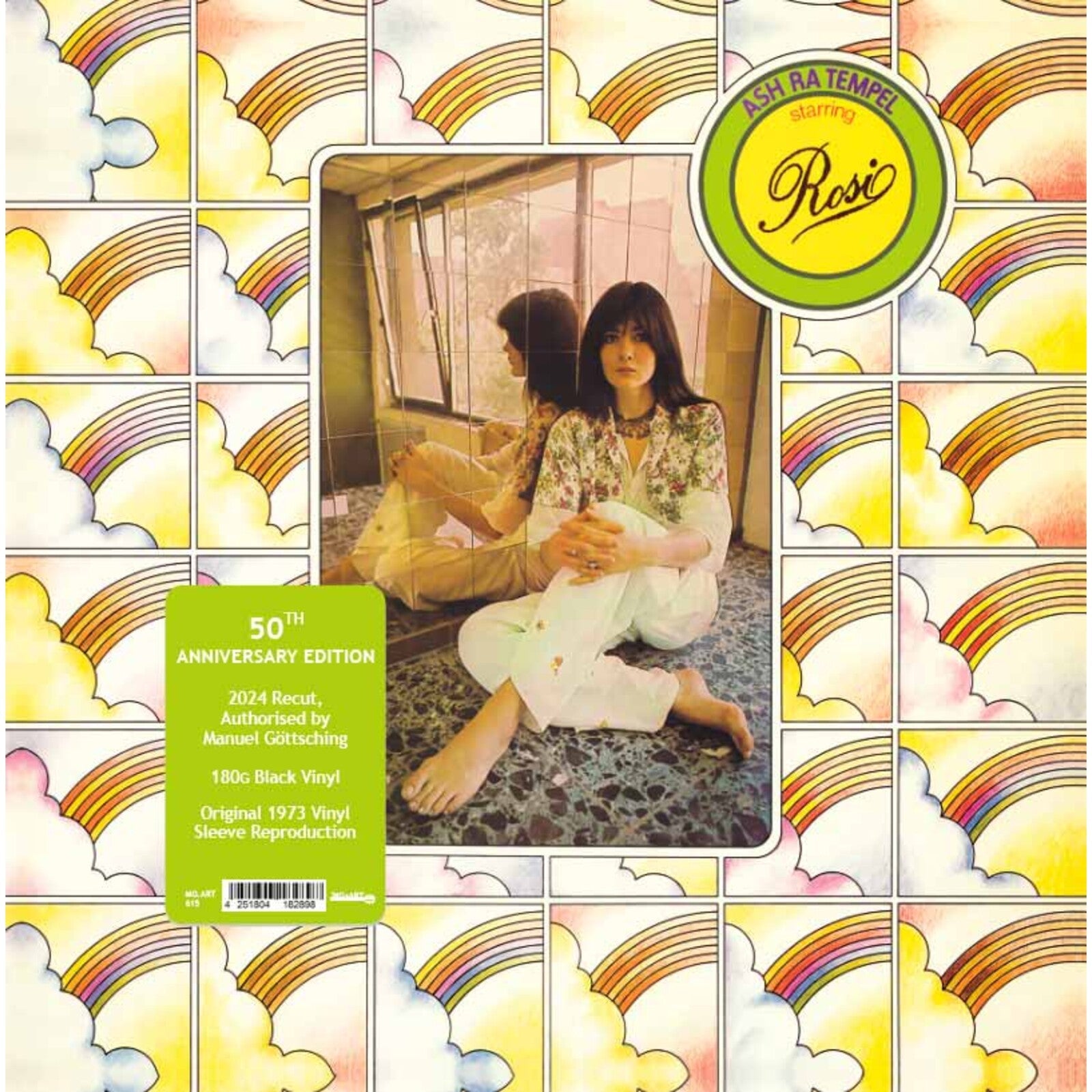 Vinyl record cover: woman in patterned room with rainbow arch design.