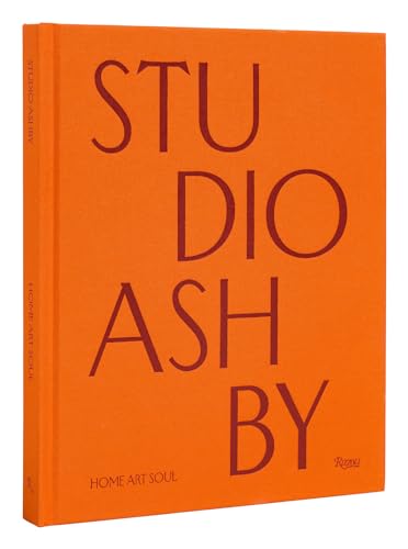 Bright orange hardcover book with dark red text reading Studio Ashby Home Art Soul.