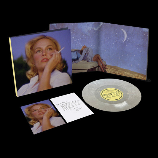 Vinyl record, gatefold cover, and signed card featuring a blonde woman’s portrait.