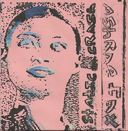 The alt text for the image is: "Pink vinyl record cover with a woman's face and text."
