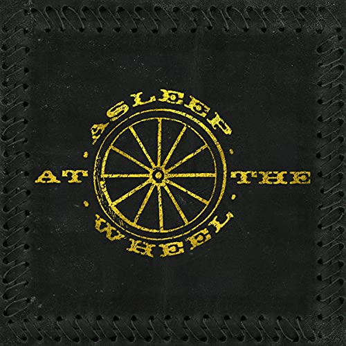 Asleep At The Wheel album cover: a black leather-textured background with a gold wheel.