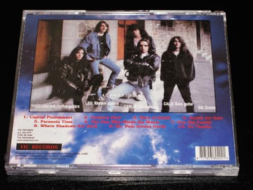 CD back cover with a band photo and tracklist against a blue sky.