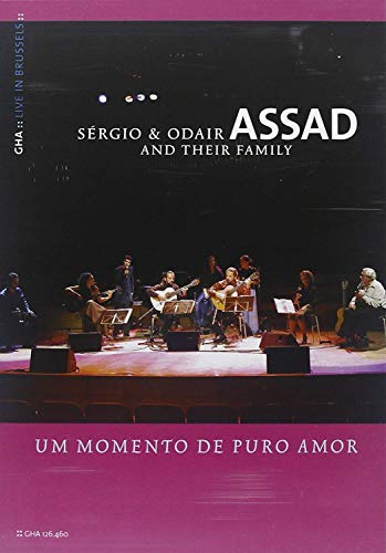 CD cover featuring the Assad family performing live on stage.