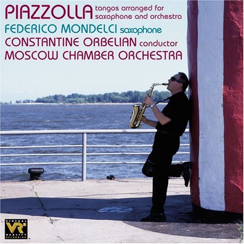 Man playing saxophone by a body of water on a CD cover.