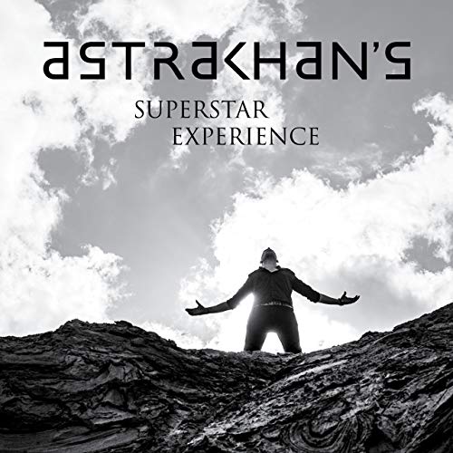 Black and white album cover with a figure silhouetted against the sky.