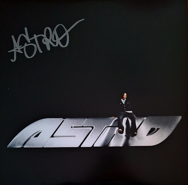 Black vinyl record cover with silver text and a seated figure.