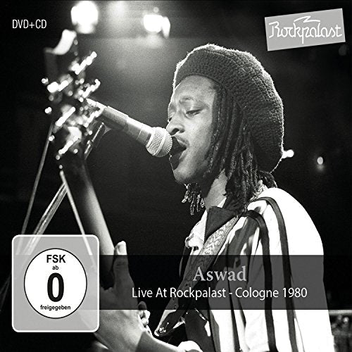 Black and white album cover featuring Aswad performing live with a guitar.